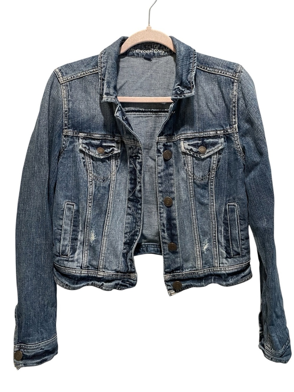 American Eagle women's cropped distressed denim jacket. Size M